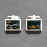 Pair of silver rectangular cuff links with moss agate centres. Swivel back.