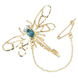 Vintage yellow gold dragonfly brooch with a blue topaz set to the centre. With diamond eyes. 