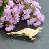 Gold pheasant brooch with a rich texture to the gold 'feathers.' 