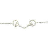 A silver horse bit pendant on a chain necklace.