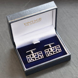 Silver rectangular cufflinks with pierced front with swivel backs. 