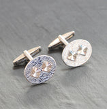 Silver oval diamond cut front cuff links with swivel back.