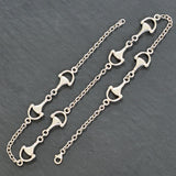 Silver horse bit necklace. A trace link chain with horse bits within the chain.