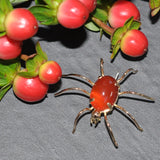 18ct Yellow gold 'spider' brooch with an oval cornelian set to the body of the spider.