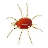 18ct Yellow gold 'spider' brooch with an oval cornelian set to the body of the spider.