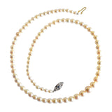 A single row of graduated cultured pearls with a diamond and sapphire clasp on a 9ct white gold chain.