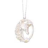 Silver oval unicorn pendant with gold onlay on the horn and multiple rose designs, on a trace link chain.