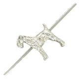 A silver brooch in the shape of a dog with a textured coat, mounted on a plain silver bar.