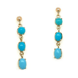 A pair of 9ct yellow gold turquoise drop earrings with three oval turquoise stones on each earring.