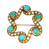 Decorative brooch with turquoise stones and pearls on a white background
