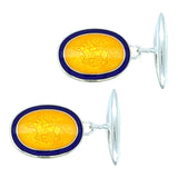 Silver oval cufflinks with yellow and blue enamel to the front with a racehorse galloping within. With a chain and torpedo back. 