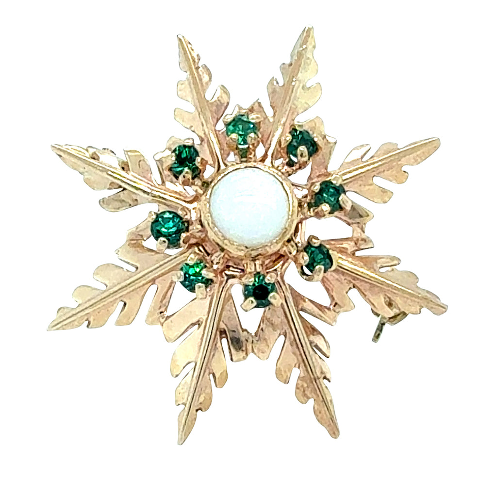 Vintage yellow gold 'star' brooch with a single opal set to the centre surrounded by 8 tsavorite gemstones.