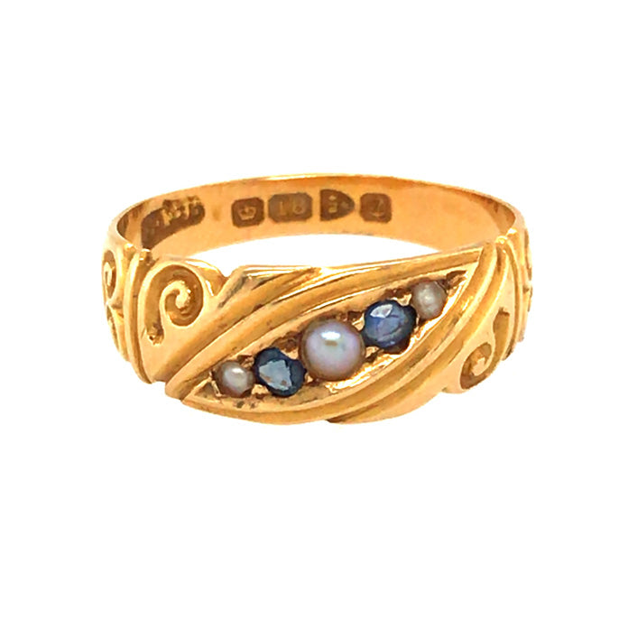 A vintage 18ct yellow gold gypsy ring with three pearls and two sapphires, hallmarked and dated Birmingham UK 1918.