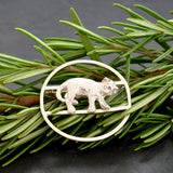 Silver circular brooch with a 'lounging cat' to the centre. A very charming cat brooch. 