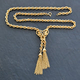 9ct yellow gold rope chain necklace with fancy centre and two tassels. Hallmarked and dated London 1976.