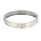 Silver bangle with horse shoe and whip to the top/centre, hallmarked and dated Birmingham 1889