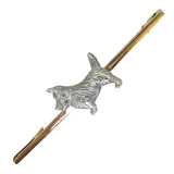 Silver dog with a textured coat on a 9ct yellow gold bar, with safety catch. 