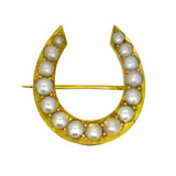 A Victorian 15ct yellow gold horseshoe brooch set with 15 pearls.