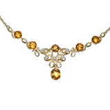 9ct yellow gold necklace with six citrine and five pearl embellishments.