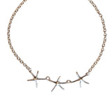 Silver trace chain necklace with three star-shaped charms and a T-Bar clasp